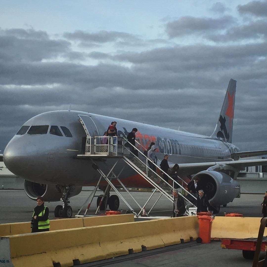 A Jetstar plane de-boarding in Melbourne